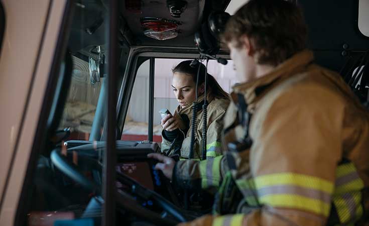 two fire fighters in a truck
