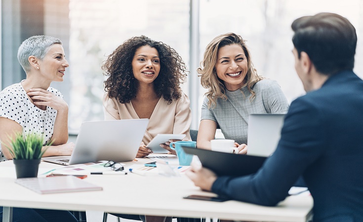 Coworkers talking at a table