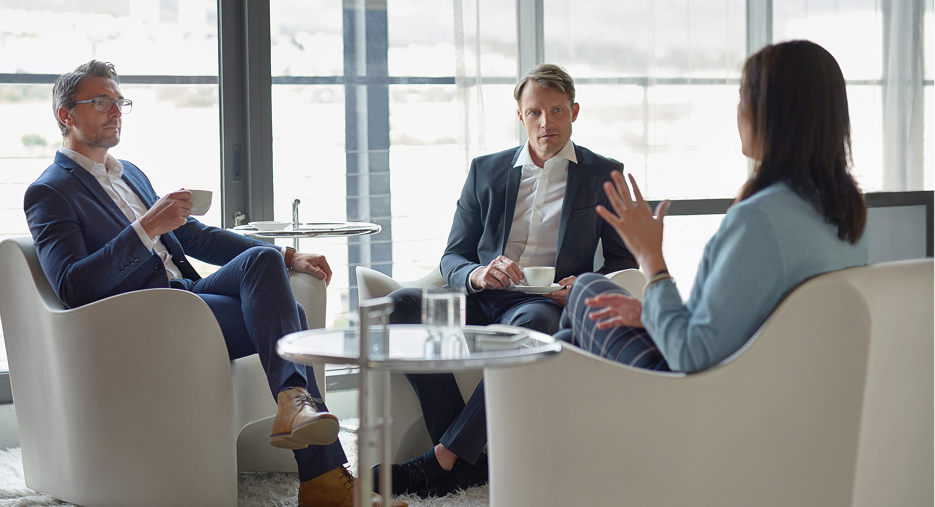 Business Professionals Meeting in Modern Office Lounge