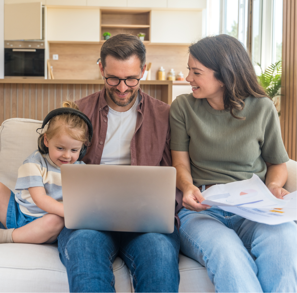 Family Using Laptop Together in Modern Living Room