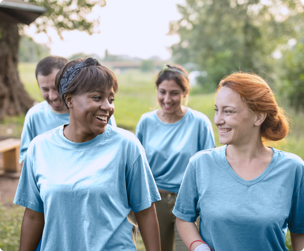 Group of young adults outdoors in blue shirts