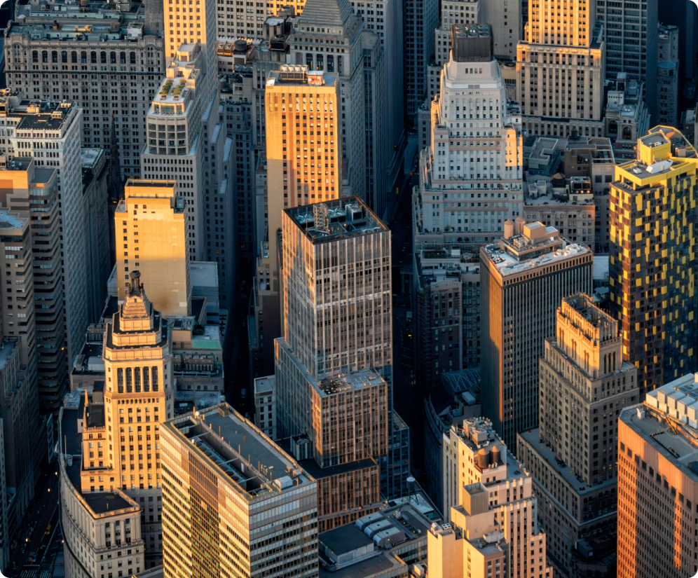 Aerial view of city skyscrapers at sunset