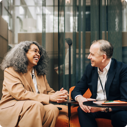 Business professionals engaged in conversation indoors