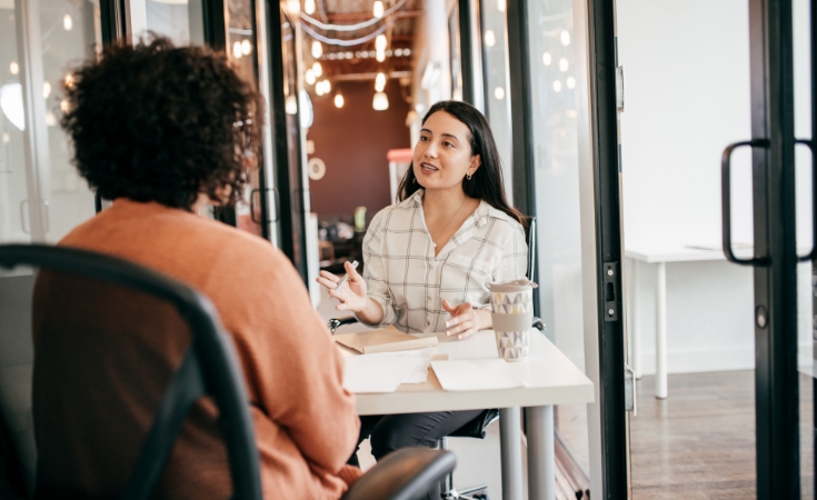 Women sitting at a table talking