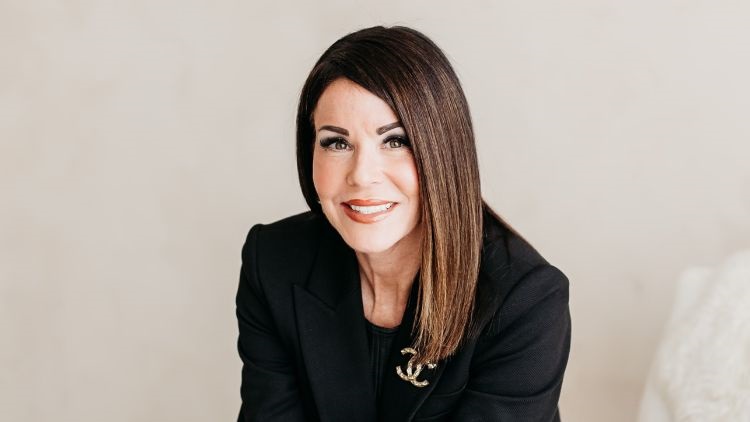 professional photograph of Lori Brown sitting and smiling