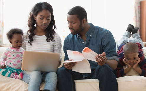 Family working on coutch