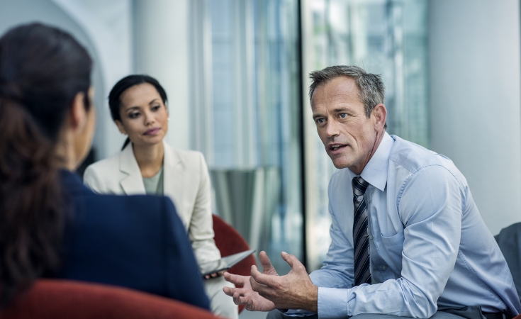 Man conducting meeting with group