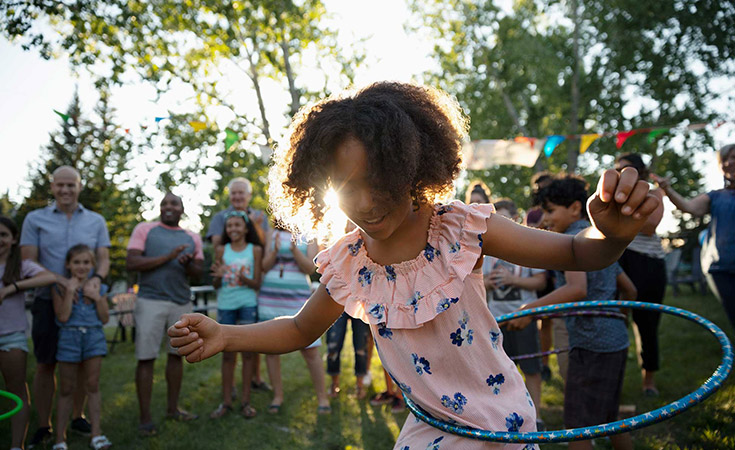 Girl playing with hula hoop
