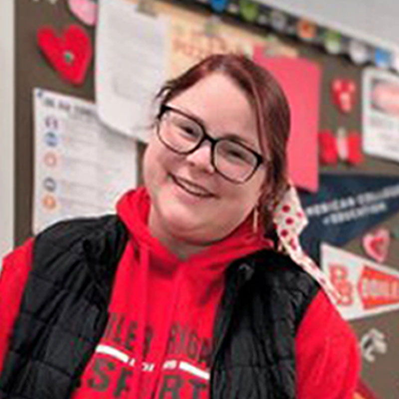 female educator smiling in classroom