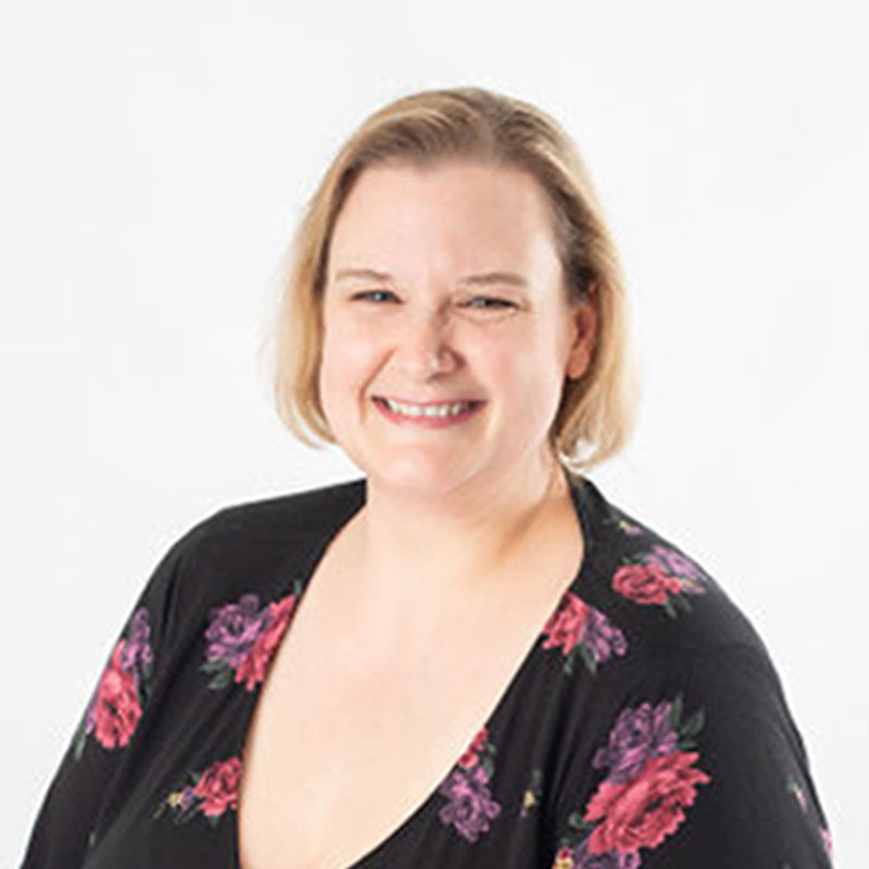 female educator smiling headshot