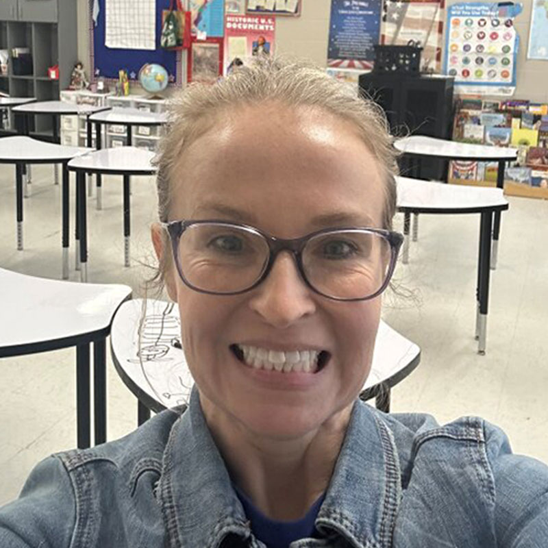 female educator smiling in classroom