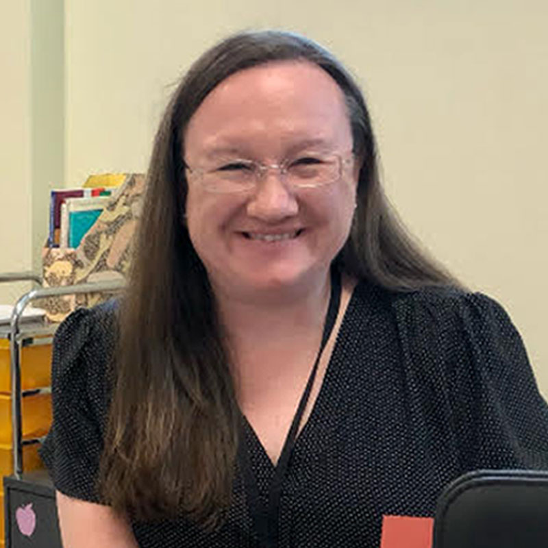 female educator smiling in classroom
