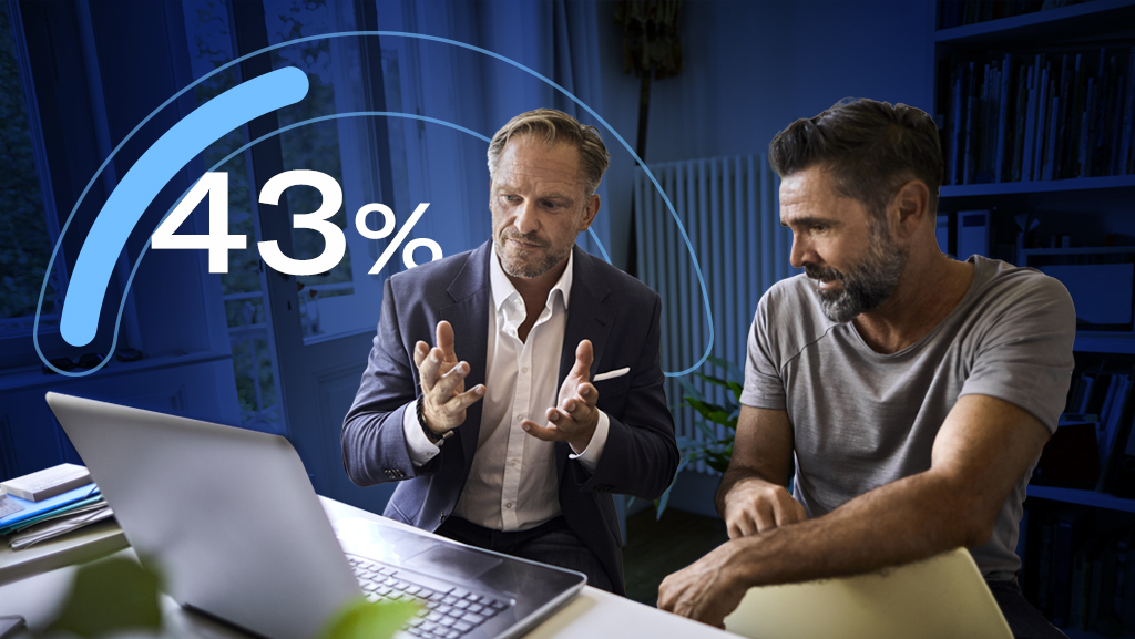 Advisor and client looking at computer with graphic of 43 percent metric