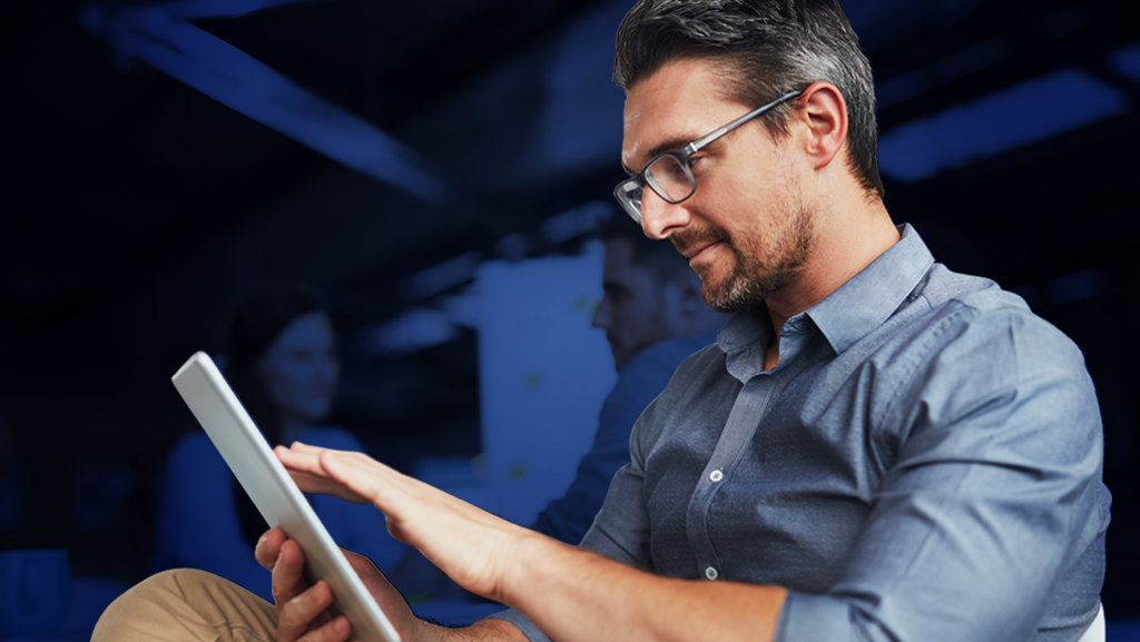 Professional man using digital tablet at office