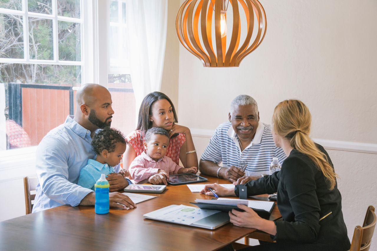 Financial advisor talking to clients