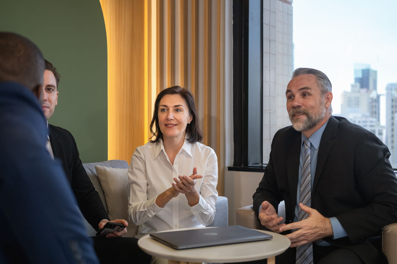 team of businessmen are brainstorming for a successful project in a friendly atmosphere in the lounge