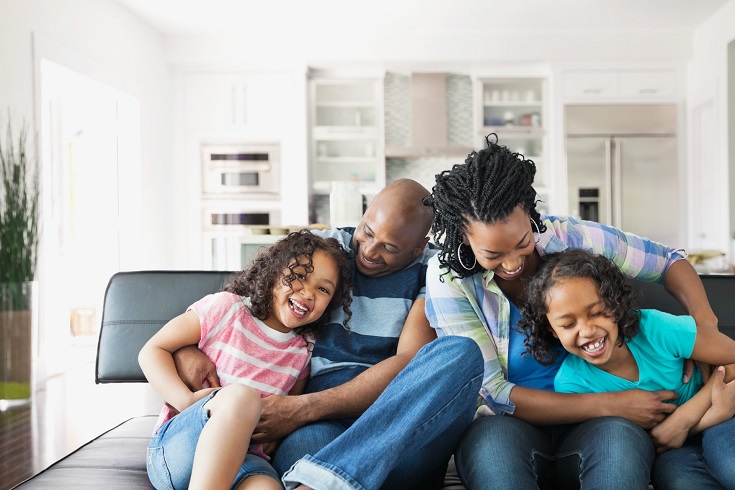 Family playing on the sofa