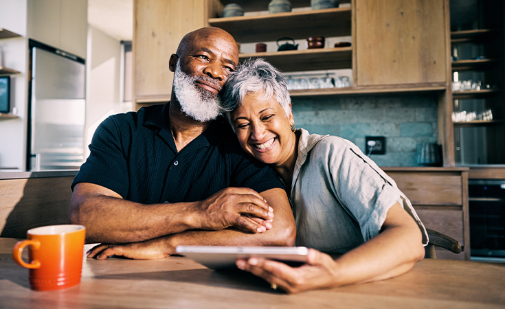 Couple with tablet in kitchen