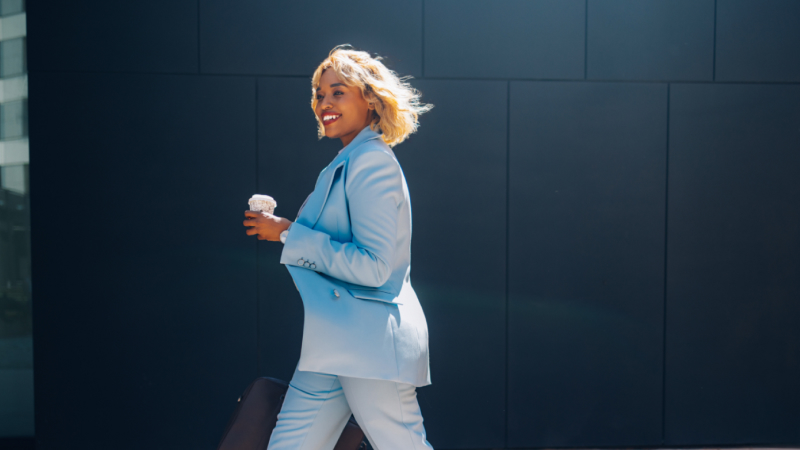 Woman walking with coffee