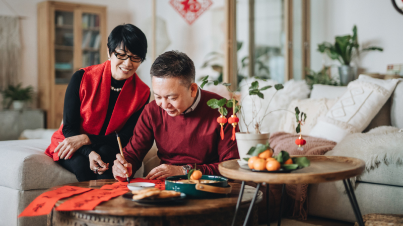 Couple working in living room