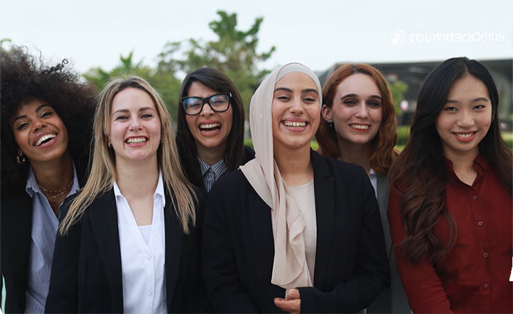 diverse group of business women smiling and laughing