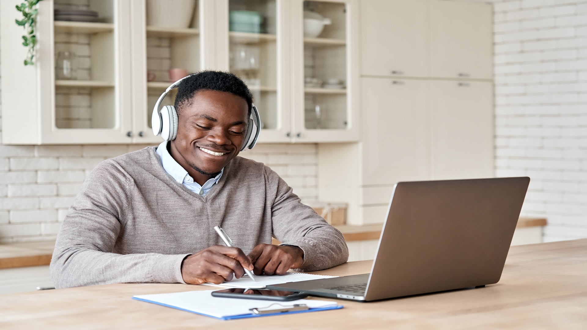 Student sitting at a desk looking at a computer